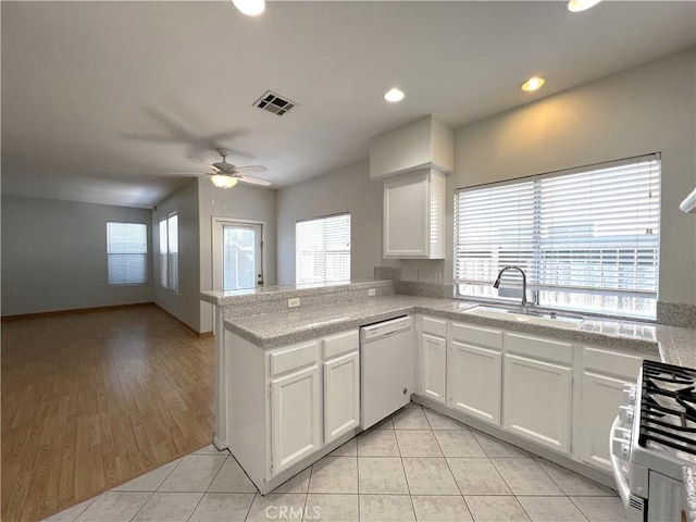 1729 Sunflower Ave Unit A, Glendora, CA 91740 - kitchen featuring white dishwasher, gas stove, a sink, healthy amount of natural light, and recessed lighting