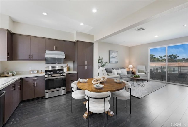 168 N Orange Ave, Brea, CA 92821 - kitchen with appliances with stainless steel finishes, under cabinet range hood, dark wood-style flooring, light countertops, and dark brown cabinetry