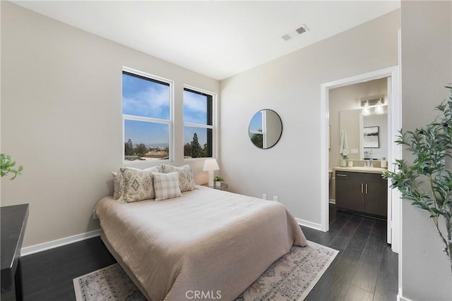 168 N Orange Ave, Brea, CA 92821 - bedroom with dark wood finished floors, baseboards, ensuite bath, and a sink