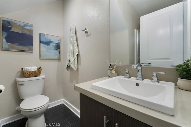 168 N Orange Ave, Brea, CA 92821 - bathroom featuring toilet, vanity, and baseboards