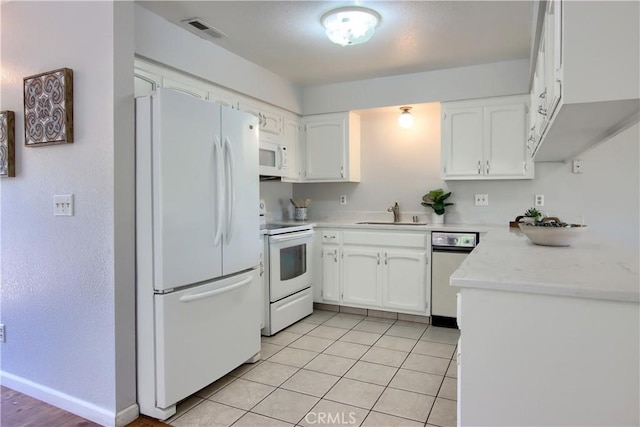 5303 State Highway 49 N Unit 14, Mariposa, CA 95338 - kitchen with white appliances, a sink, white cabinetry, light countertops, and light tile patterned floors