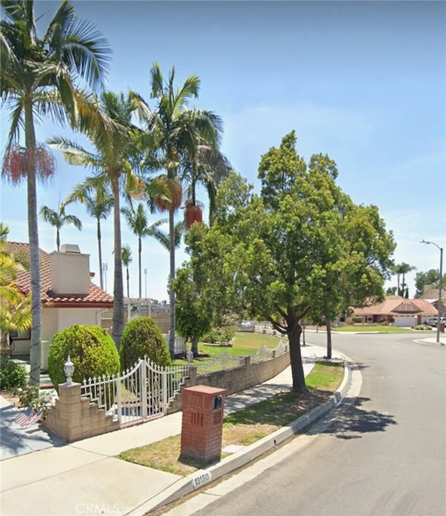 13150 Stern Ave, La Mirada, CA 90638 - view of front facade with a tiled roof and a chimney