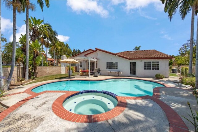 13150 Stern Ave, La Mirada, CA 90638 - view of pool with a pool with connected hot tub, a pergola, a fenced backyard, and a patio area
