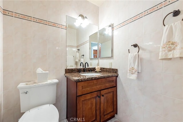 13150 Stern Ave, La Mirada, CA 90638 - bathroom with tile walls, vanity, and toilet