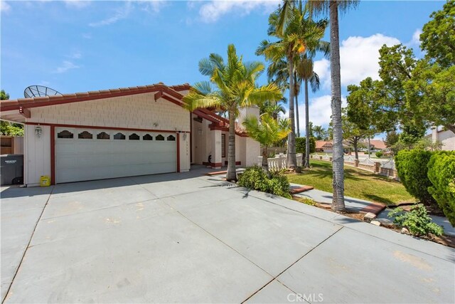 13150 Stern Ave, La Mirada, CA 90638 - view of front of house with a garage and concrete driveway