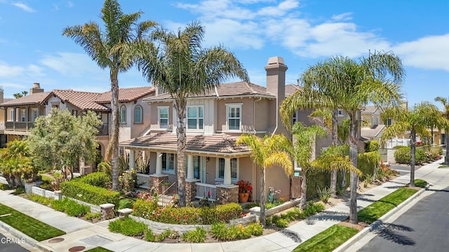 4003 Galapagos Way, Oxnard, CA 93035 - view of front of home featuring stucco siding, a tiled roof, covered porch, and a residential view