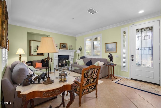 4003 Galapagos Way, Oxnard, CA 93035 - living room featuring crown molding, light tile patterned flooring, a glass covered fireplace, baseboards, and recessed lighting