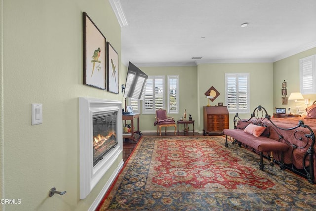 4003 Galapagos Way, Oxnard, CA 93035 - living area featuring ornamental molding, a glass covered fireplace, baseboards, and wood finished floors