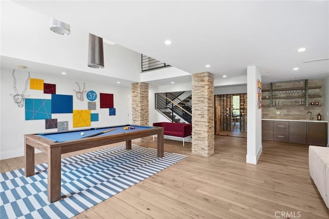1435 Cerritos Dr, Laguna Beach, CA 92651 - rec room with ornate columns, billiards table, bar with sink, light wood finished floors, and recessed lighting