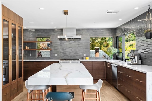 1435 Cerritos Dr, Laguna Beach, CA 92651 - kitchen with modern cabinets, stainless steel dishwasher, wall chimney range hood, a sink, and light wood-style flooring