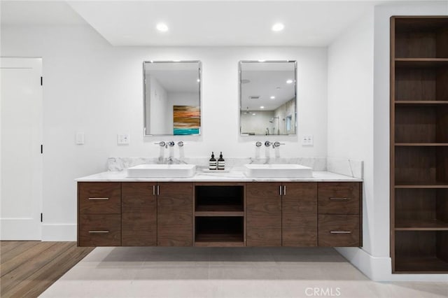 1435 Cerritos Dr, Laguna Beach, CA 92651 - full bathroom with double vanity, wood finished floors, and recessed lighting