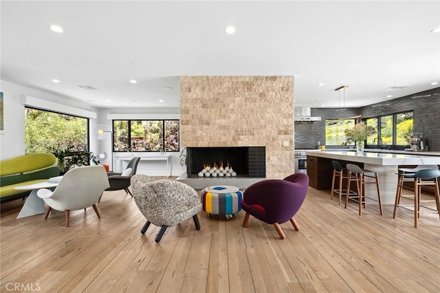 1435 Cerritos Dr, Laguna Beach, CA 92651 - living area with light wood-style floors, recessed lighting, and a fireplace