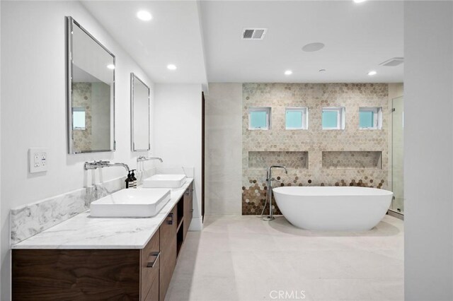 1435 Cerritos Dr, Laguna Beach, CA 92651 - bathroom with a freestanding bath, double vanity, recessed lighting, and tile patterned flooring