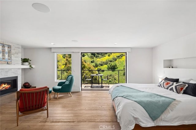 1435 Cerritos Dr, Laguna Beach, CA 92651 - bedroom featuring access to exterior, a fireplace, and wood finished floors