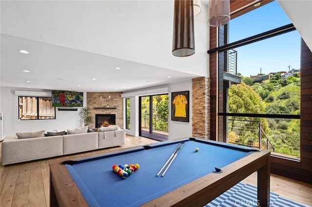 1435 Cerritos Dr, Laguna Beach, CA 92651 - playroom with pool table, hardwood / wood-style flooring, recessed lighting, and a large fireplace