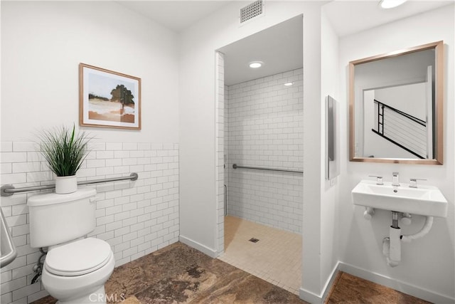 645 Channel Way, Costa Mesa, CA 92627 - full bath featuring toilet, a tile shower, and tile walls