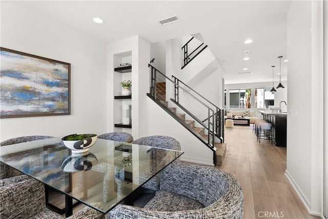 645 Channel Way, Costa Mesa, CA 92627 - dining room with wood finished floors, stairway, recessed lighting, and built in features