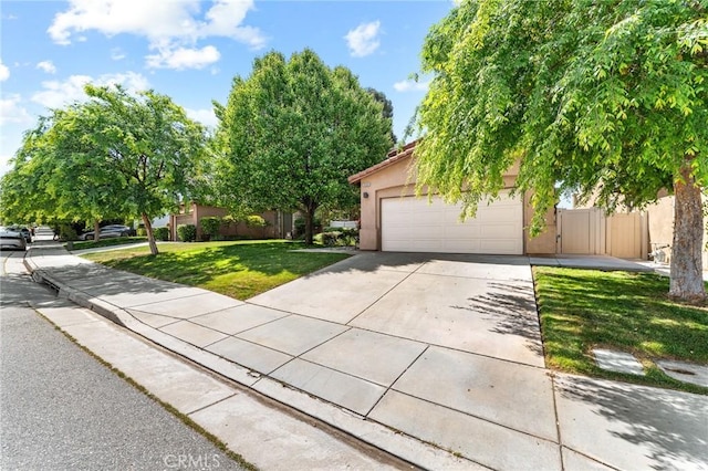 35509 Trevino Trl, Beaumont, CA 92223 - obstructed view of property with concrete driveway, a front yard, an attached garage, and stucco siding