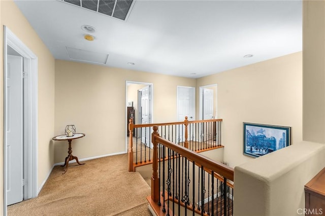 35509 Trevino Trl, Beaumont, CA 92223 - corridor with an upstairs landing, carpet floors, baseboards, and attic access