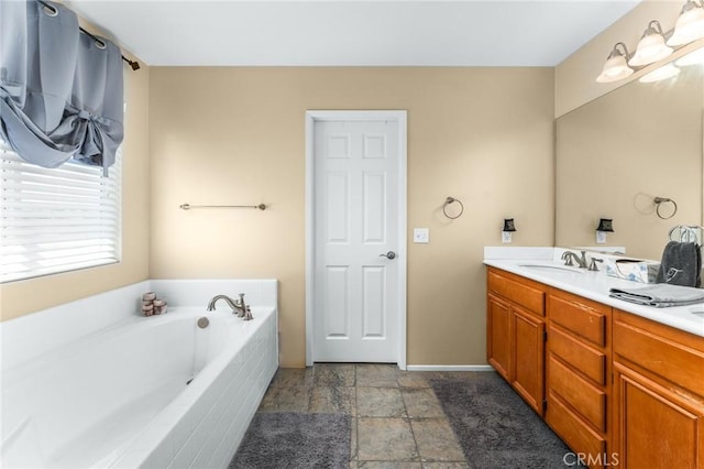 35509 Trevino Trl, Beaumont, CA 92223 - full bath featuring double vanity, a bath, stone finish flooring, and baseboards