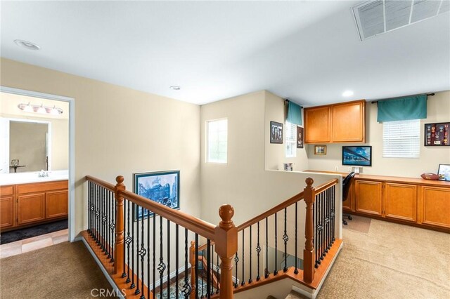 35509 Trevino Trl, Beaumont, CA 92223 - corridor featuring an upstairs landing, light carpet, healthy amount of natural light, a sink, and recessed lighting