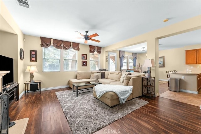 35509 Trevino Trl, Beaumont, CA 92223 - living area with a ceiling fan, dark wood finished floors, and baseboards