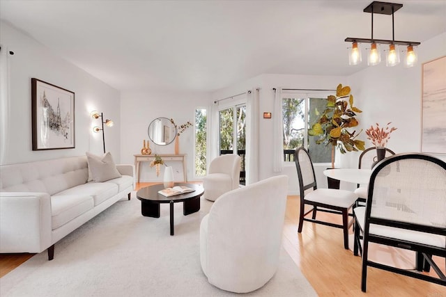 7077 Camino Pacheco, San Diego, CA 92111 - living room featuring light wood finished floors