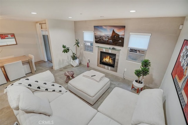11023 Fruitland Dr Unit 104, Studio City, CA 91604 - living area with a glass covered fireplace, plenty of natural light, recessed lighting, and baseboards