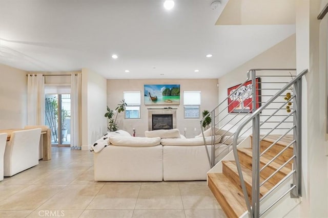 11023 Fruitland Dr Unit 104, Studio City, CA 91604 - living area with light tile patterned floors, recessed lighting, and a glass covered fireplace