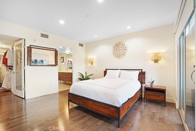 11023 Fruitland Dr Unit 104, Studio City, CA 91604 - bedroom featuring wood finished floors, ensuite bathroom, and recessed lighting