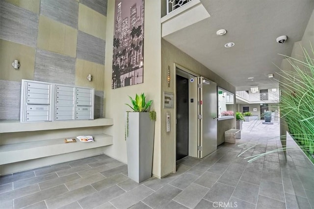 11023 Fruitland Dr Unit 104, Studio City, CA 91604 - property entrance with elevator and a surveillance system