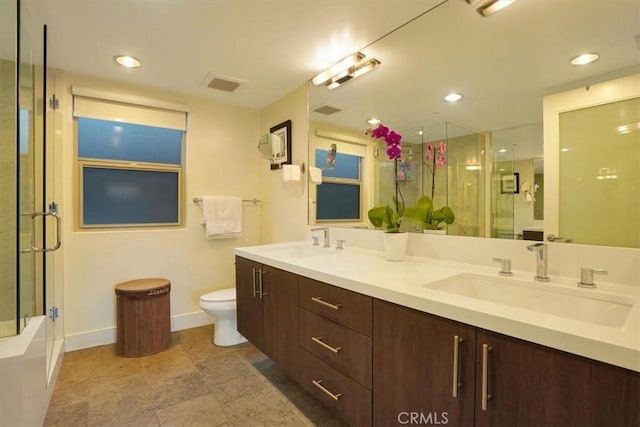 11023 Fruitland Dr Unit 104, Studio City, CA 91604 - bathroom featuring a shower with door, double vanity, toilet, baseboards, and a tub