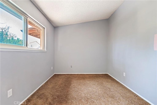 6164 Amberwood Dr, Rancho Cucamonga, CA 91701 - carpeted empty room with a textured ceiling and baseboards