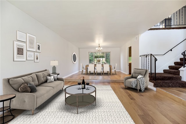 6164 Amberwood Dr, Rancho Cucamonga, CA 91701 - living room featuring wood finished floors, a chandelier, stairs, and baseboards