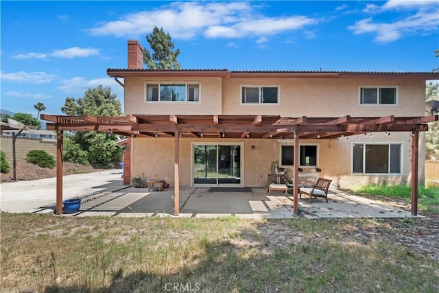 6164 Amberwood Dr, Rancho Cucamonga, CA 91701 - back of property with a pergola, stucco siding, a chimney, and a patio