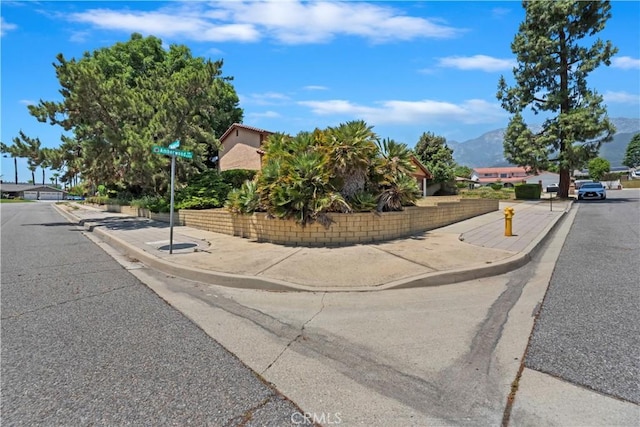 6164 Amberwood Dr, Rancho Cucamonga, CA 91701 - view of asphalt street featuring sidewalks, curbs, and a mountain view