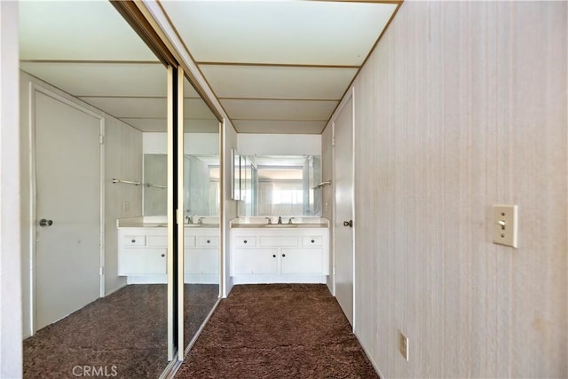 6164 Amberwood Dr, Rancho Cucamonga, CA 91701 - corridor with dark carpet and a sink