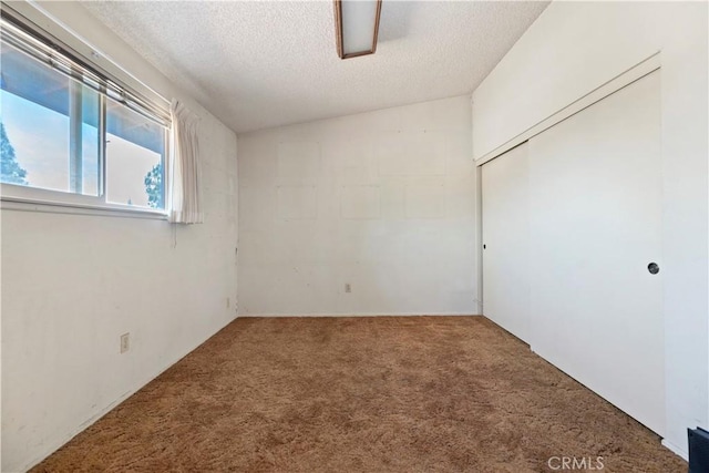 6164 Amberwood Dr, Rancho Cucamonga, CA 91701 - carpeted empty room featuring a textured ceiling