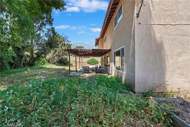 6164 Amberwood Dr, Rancho Cucamonga, CA 91701 - view of yard featuring a pergola and a patio area