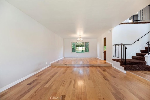6164 Amberwood Dr, Rancho Cucamonga, CA 91701 - interior space with a chandelier, stairs, light wood-style flooring, and baseboards