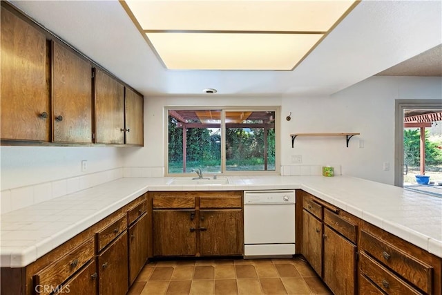 6164 Amberwood Dr, Rancho Cucamonga, CA 91701 - kitchen featuring dishwasher, a sink, light tile patterned floors, open shelves, and tile countertops