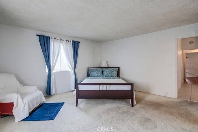 327 S 35th St, San Diego, CA 92113 - bedroom featuring carpet flooring and a textured ceiling