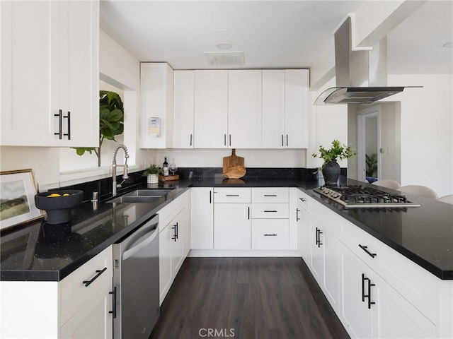 5512 W 117th St, Hawthorne, CA 90304 - kitchen with appliances with stainless steel finishes, a sink, wall chimney exhaust hood, a peninsula, and white cabinetry