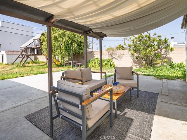 5512 W 117th St, Hawthorne, CA 90304 - fenced backyard featuring an outdoor hangout area, a patio area, and a playground