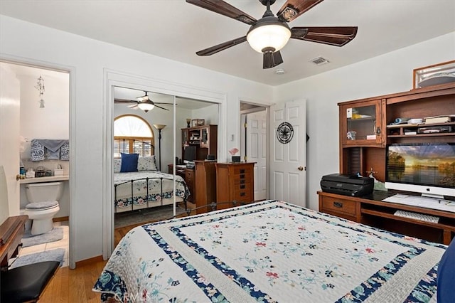 6096 Crawford St, San Diego, CA 92120 - bedroom with wood finished floors, a closet, and a ceiling fan