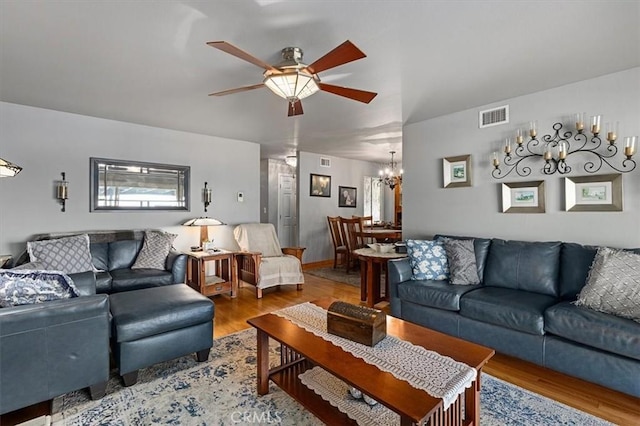 6096 Crawford St, San Diego, CA 92120 - living room featuring a chandelier, ceiling fan, and wood finished floors