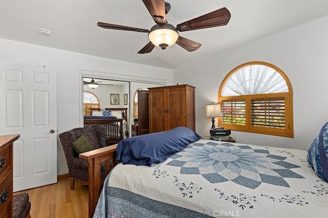 6096 Crawford St, San Diego, CA 92120 - bedroom featuring light wood-style floors, a ceiling fan, and a closet
