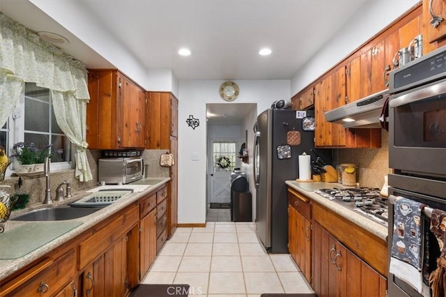 6096 Crawford St, San Diego, CA 92120 - kitchen with a sink, tasteful backsplash, brown cabinetry, and recessed lighting