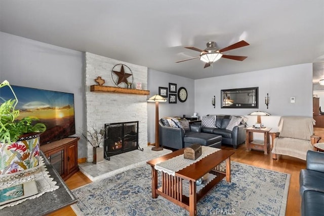 6096 Crawford St, San Diego, CA 92120 - living room with light wood-style floors, a fireplace, and ceiling fan