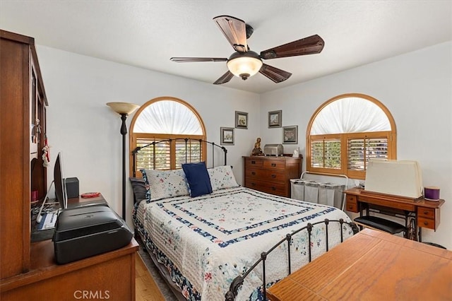 6096 Crawford St, San Diego, CA 92120 - bedroom featuring multiple windows, a ceiling fan, and light wood-style flooring